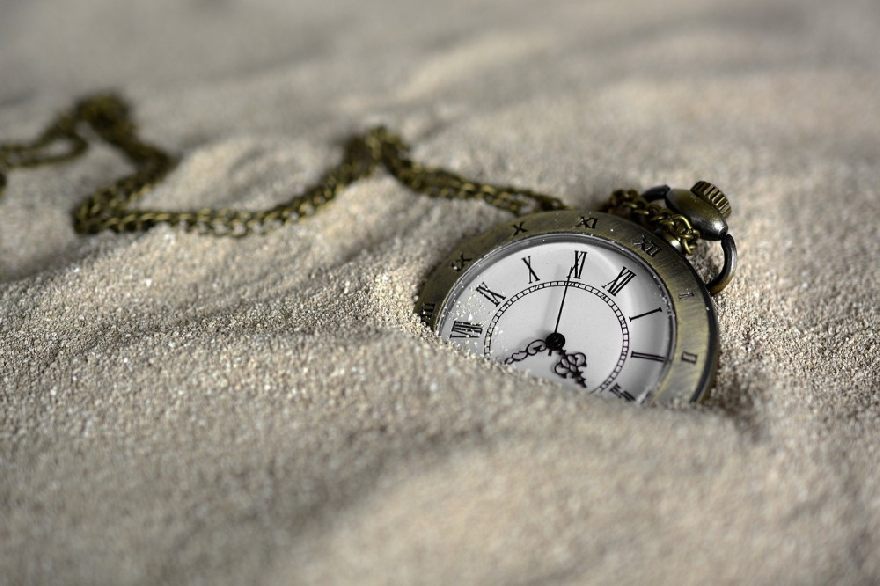 Pocket watch in the sand.